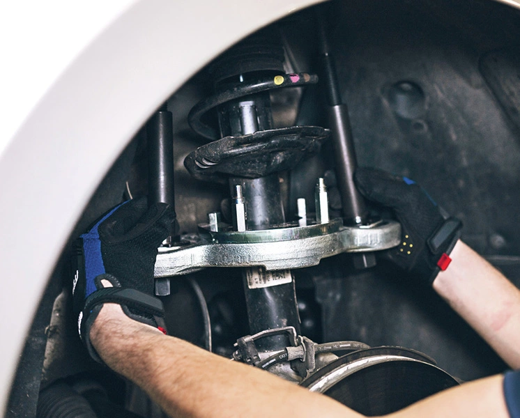 GEDORE special tool used on a passenger car suspension strut