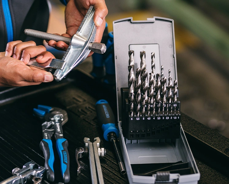 Twist drill set next to GEDORE tools for metalworking