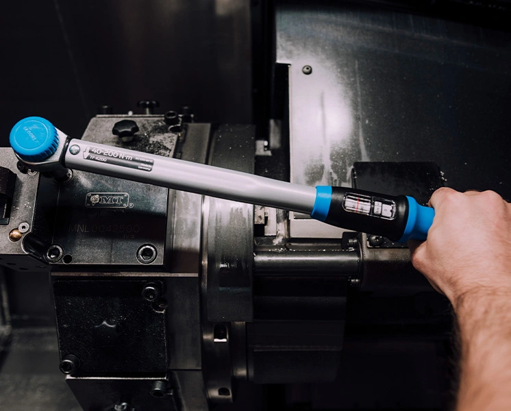 GEDORE torque wrench tightening a connection on a machine with controlled torque