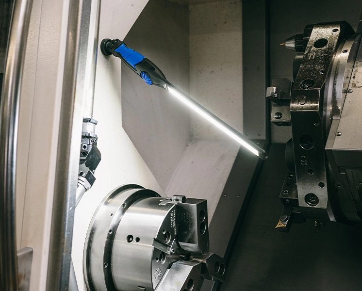 GEDORE work light illuminating the interior of a machine tool