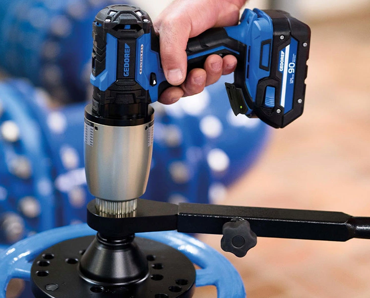 GEDORE high-torque cordless wrench operating an industrial valve